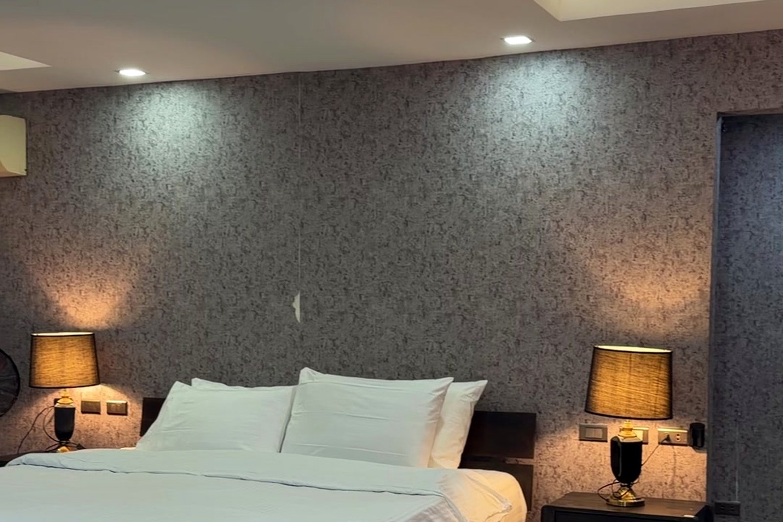 Bedroom suite with warm bedside lighting